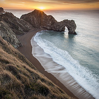 Buy canvas prints of Warming Winter sunrise at Durdle Door  by Shaun Jacobs