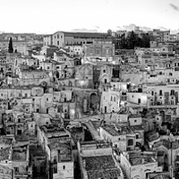 Buy canvas prints of Matera Sassi by Julie Woodhouse