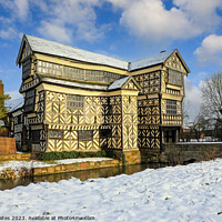 Buy canvas prints of Little Moreton Hall, Cheshire in the winter snow.  by John Keates