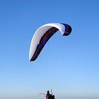 Buy canvas prints of Paraglider, Westbury White Horse, Wiltshire, UK by Andrew Harker