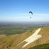 Buy canvas prints of Paragliders, Westbury White Horse, Wiltshire, UK by Andrew Harker
