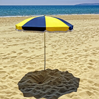 Buy canvas prints of A Sun Umbrella on Bournemouth Beach, Dorset, UK by Andrew Harker