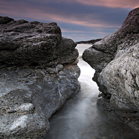 Buy canvas prints of A Face in the rocks by David Stephens