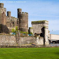 Buy canvas prints of Train Passing Conwy Castle Wales by Pearl Bucknall