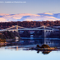 Buy canvas prints of Menai Bridge and Snowdonia from Anglesey in Winter by Pearl Bucknall