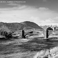 Buy canvas prints of Llanrwst Bridge and Conwy River in Black and White by Pearl Bucknall