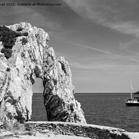 Buy canvas prints of Rock Arch in the Bay Anglesey Coast Black and Whit by Pearl Bucknall