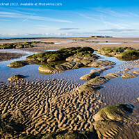 Buy canvas prints of Rocks and Sand Hilbre Island in Dee Estuary by Pearl Bucknall