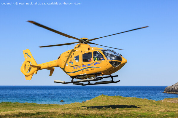 Scottish Ambulance Helicopter Lifting Off Picture Board by Pearl Bucknall