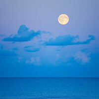 Buy canvas prints of Full Moon Rising in the Sky over a Seascape by Pearl Bucknall