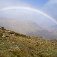Buy canvas prints of Rainbow over Snowdonia by Pearl Bucknall