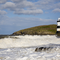 Buy canvas prints of Penmon Lighthouse in Rough Seas off Anglesey by Pearl Bucknall