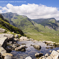 Buy canvas prints of Looking Across a Mountain Stream in Snowdonia by Pearl Bucknall