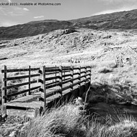 Buy canvas prints of Monochrome Footbridge in Snowdonia Wales by Pearl Bucknall