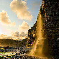 Buy canvas prints of Sunset Waterfall, cliff, Nash Point, Wales, UK by Bernd Tschakert