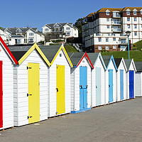 Buy canvas prints of colourful beach huts by Kevin Britland