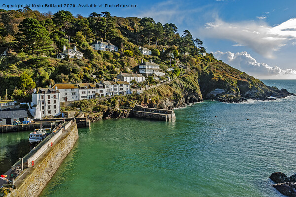 the harbour entrance at polperro in cornwall Picture Board by Kevin Britland