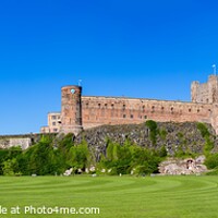 Buy canvas prints of Bamburgh Castle, Cricket Pitch and Windmill by Graham Prentice