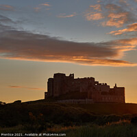 Buy canvas prints of Bamburgh Castle  at Sunset by Graham Prentice