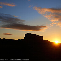 Buy canvas prints of Bamburgh Castle at Sunset by Graham Prentice
