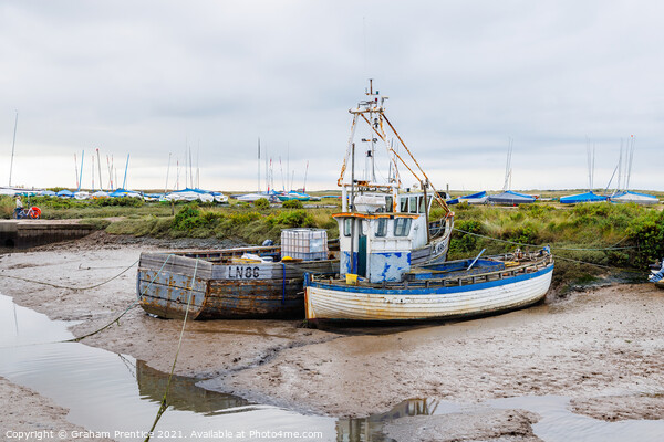 Brancaster Staithe Fishing Boats at Low Tide Picture Board by Graham Prentice