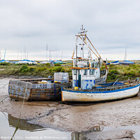 Buy canvas prints of Brancaster Staithe Fishing Boats at Low Tide by Graham Prentice