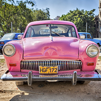 Buy canvas prints of  A Very Pink Classic Vintage Car In Havana, Cuba by Graham Prentice