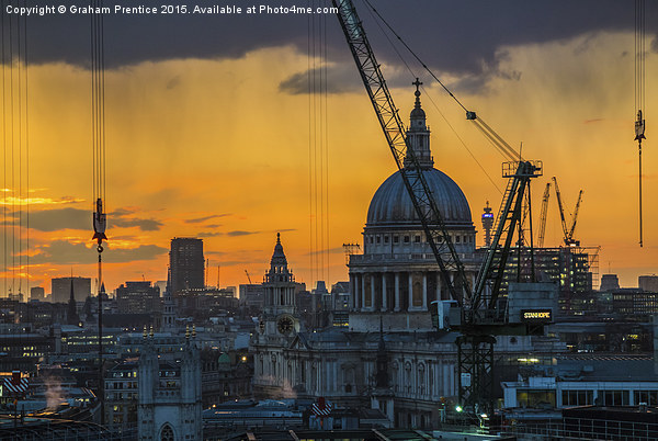 Sunset over St Paul's Cathedral with cranes Picture Board by Graham Prentice