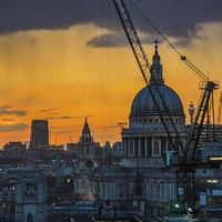 Buy canvas prints of Sunset over St Paul's Cathedral with cranes by Graham Prentice