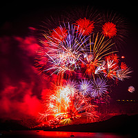 Buy canvas prints of Spectacular fireworks over Santorini by Graham Prentice