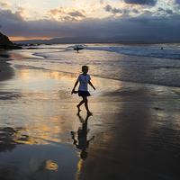 Buy canvas prints of  Silhouette of little girl at Byron by Sheila Smart
