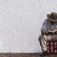 Buy canvas prints of  Man reading sitting on a crate by Sheila Smart