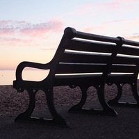 Buy canvas prints of Brighton Promenade Bench At Sunset by Liz Watson