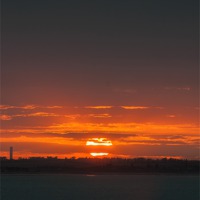 Buy canvas prints of Sunset over the Isle of Sheppey by Diane Griffiths