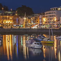 Buy canvas prints of Torquay Harbour and Town at Night by Diane Griffiths