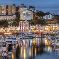 Buy canvas prints of Torquay Harbour and Town at Night by Diane Griffiths