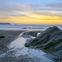 Buy canvas prints of Fistral Beach Sunset by the rocks by Diane Griffiths
