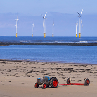 Buy canvas prints of Tractor and Windfarm by Peter Jordan