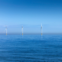Buy canvas prints of Wind Farm Calm Sea by Peter Jordan