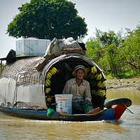 Buy canvas prints of Cambodian River Trader by Robert Murray