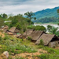Buy canvas prints of Tribal Village on the Mekong, Laos. by Robert Murray