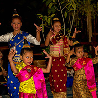 Buy canvas prints of Laos children in traditional costumes dancing by Robert Murray