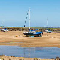 Buy canvas prints of Trio of boats beached at Wells next the Sea by Jason Wells