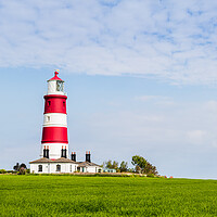 Buy canvas prints of Happisburgh lighthouse under a blue sky by Jason Wells
