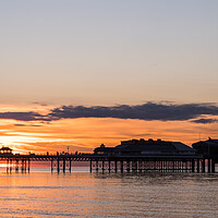 Buy canvas prints of Sunset behind Cromer Pier by Jason Wells
