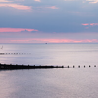 Buy canvas prints of Groynes at Cromer at sunset by Jason Wells