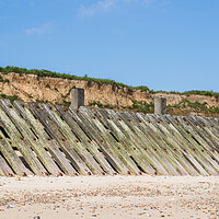 Buy canvas prints of Happisburgh revetments under the cliffs by Jason Wells