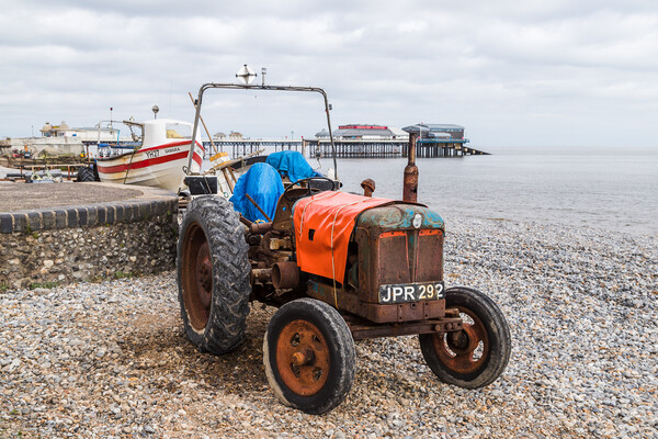 Old tractor on Cromer beach Picture Board by Jason Wells