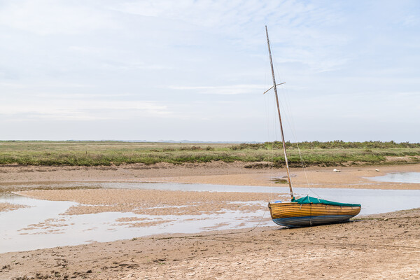 Sailing boat beached at low tide at Blakeney Picture Board by Jason Wells