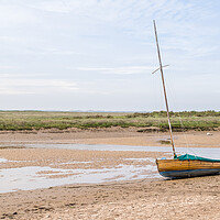 Buy canvas prints of Sailing boat beached at low tide at Blakeney by Jason Wells
